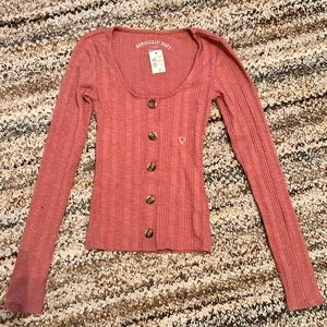 Women’s pink long sleeve shirt with buttons